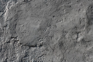 Grey textured plaster on an old wall. Background.
