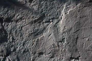 Grey textured plaster on an old wall. Background.