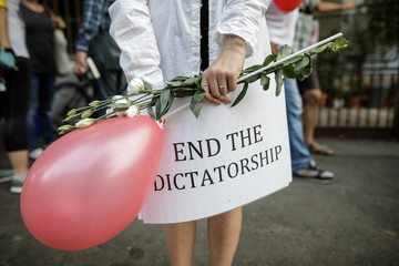 Details with a banner held by a woman during a political rally supporting the protests in Belarus.