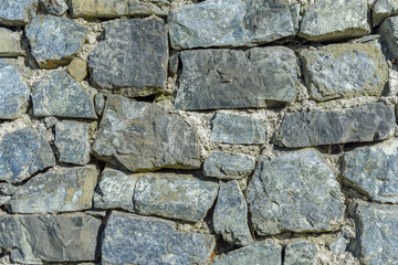 Design decorative uneven cracked real stone wall surface