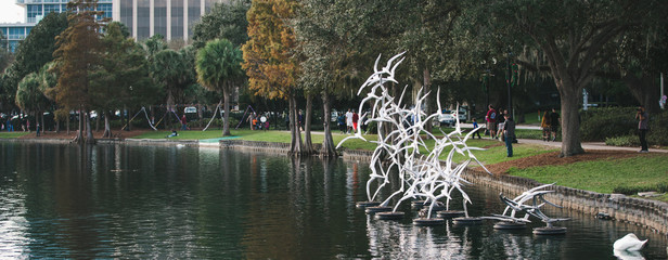 Bird monument artwork in a lake stroll through downtown Lake Eola on Orlando Florida on a fall...