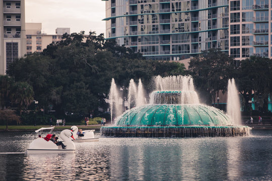 The lake Eola fountain in downtown orlando florida in central florida Lake Eola Park is located in the heart of Downtown Orlando, with a sidewalk that circles the lake .9 miles in length