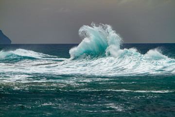 Waves crashing on the headlands on the north shore of Kauai, Hawaii.