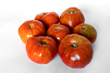 super organic tomatoes freshly picked from my garden on white background