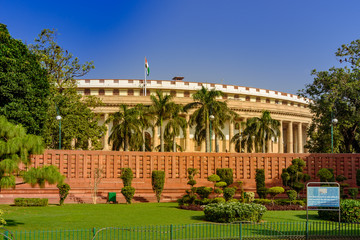 Obraz premium The Sansad Bhawan or Parliament Building is the house of the Parliament of India, New Delhi. It was designed based on Ashoka Chakra by the British architect Edwin Lutyens & Herbert Baker in 1912-13.