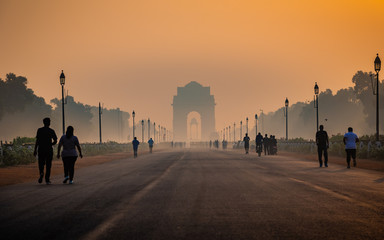 Hazy silhouette view of India Gate due to heavy smog. In morning particulate matter PM10 & 2.5...