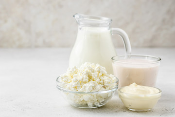 Dairy products, milk, yogurt, cottage cheese, cheese sauce. Copy space.
