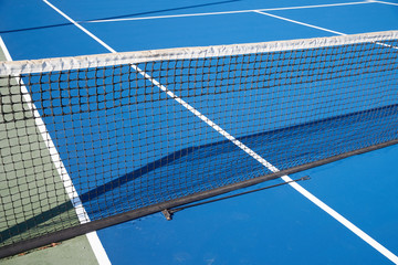 Fototapeta na wymiar A view of a tennis net from an angle