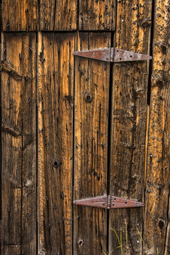 Old Barn Entrance With Rusty Hinges