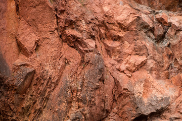 Fragment of the red dolomite wall of Kiutaköngäs rapids in Oulanka National Park, northern Finland
