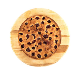 Top view. Pie with cherries on a cutting board isolated on a white background.
