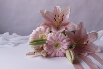 Background with bouquet with pink flowers, lilys and gerbera daisy