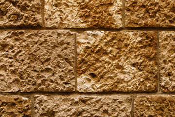 Ancient wall made of rectangular natural stones.