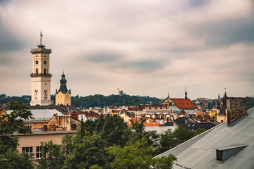 Obraz premium Europe city moody cloudy weather day time old buildings and town hall tower landmark picture from view point of top