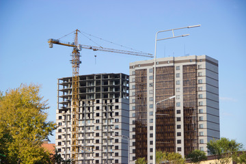 
Buildings under construction and under construction with a crane