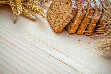 Rye bread. Bakery with crusty loaves and crumbs. Fresh loaf of rustic traditional bread with wheat...