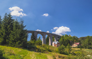 Fototapeta na wymiar Railway viaduct in Smrzovka, Jizera mountains, Czech republic