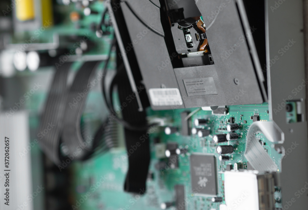 Aufkleber a close-up microchip with many electrical components placed on the board. the background is blurred.