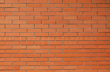 Brick red wall. Background of a new brick house.