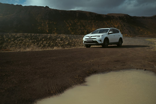 Southern Region, Iceland - September 13, 2019: White car Toyota RAV4 is parked at countryside off road in Iceland. Rental car