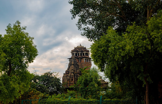 A landscape having a fortress with temple like dome in front and lush green trees around, situated at Pearl Hill, Udaipur, Rajasthan.