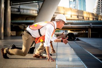 Engineers, technicians Caucasian man are acting in preparation for running, On train station...