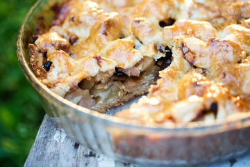 Apple pie with raisins, almonds and cinnamon