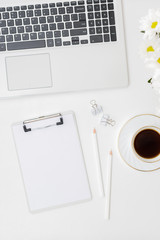 Mockup clipboard, laptop a cup of coffee on a white background