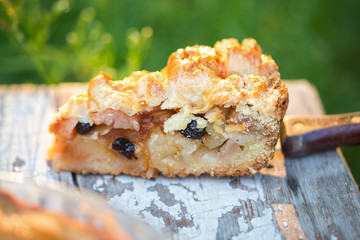 Apple pie with raisins, almonds and cinnamon