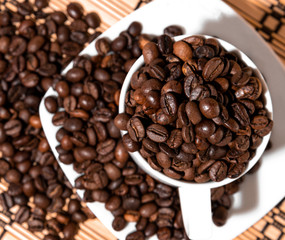 white cup full of coffee beans