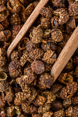 fragrant Sichuan pepper on white acrylic background