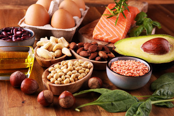 Selection of healthy food for heart, life concept with eggs and avocado on background
