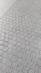 Fragment of the pavement, finished with graceful polished stone