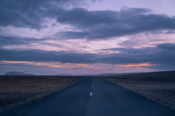 Iceland roads. Travel nature landscape. Drive on the road at sunset