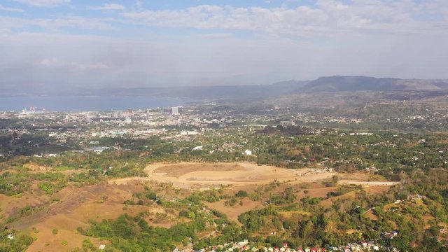 Cityscape of Cagayan de Oro, with modern buildings and residential areas. Mindanao, Philippines. City in Asia view from above.