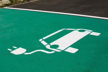 Parking symbol on the street for electric cars being charged