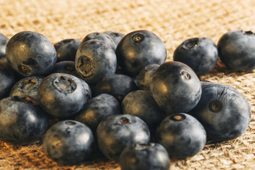 Blueberries on a napkin from sacking. Freshly picked blueberries in burlap background.Concept for healthy eating and nutrition