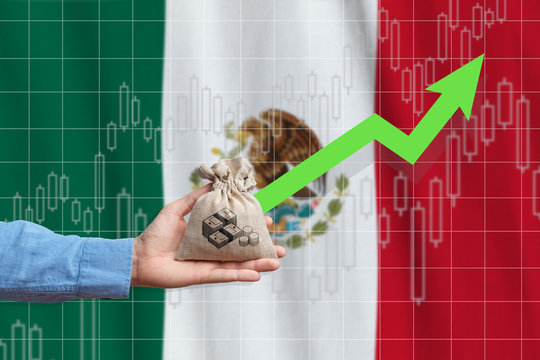 The concept of economic growth in United Mexican States. Hand holds a bag with money and an upward arrow