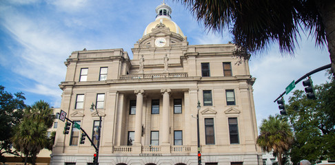 Clock towers building called savannah Georgia on a cobblestone path in old town in the Savannah City Hall Clock Tower