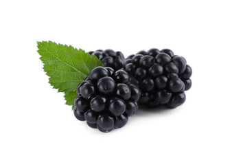 Tasty ripe blackberries and leaf on white background