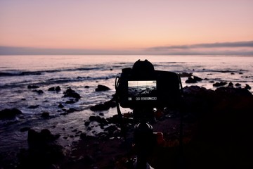 a camera recording a sunset on the california coast