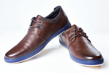 Men fashion brown shoe leather over white background. Pair casual stylish footwear.