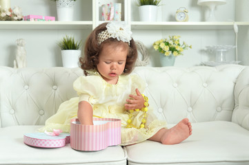 Cute little baby girl with gift box