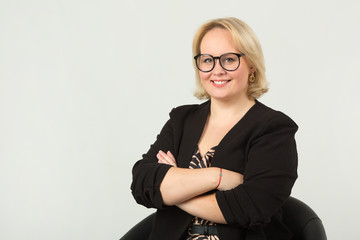 beautiful young woman on a white background wearing glasses