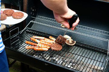 Frying sausages, hot dogs for barbecue. Simmer grill.