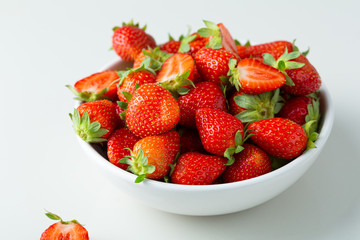 Close up of Fresh strawberry harvest in white bowl