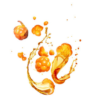 Whole and sliced cloudberry with splashes of juice on a white background