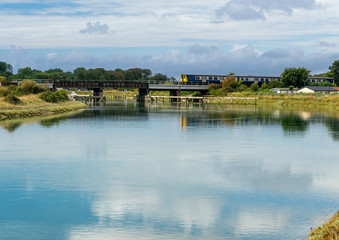 Fototapeta na wymiar Train crossing the River Arun viaduct 