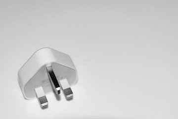 Isolated British electric plug, white background.