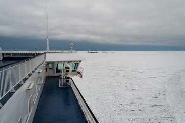 a passenger ferry running on the ice-bound bay
